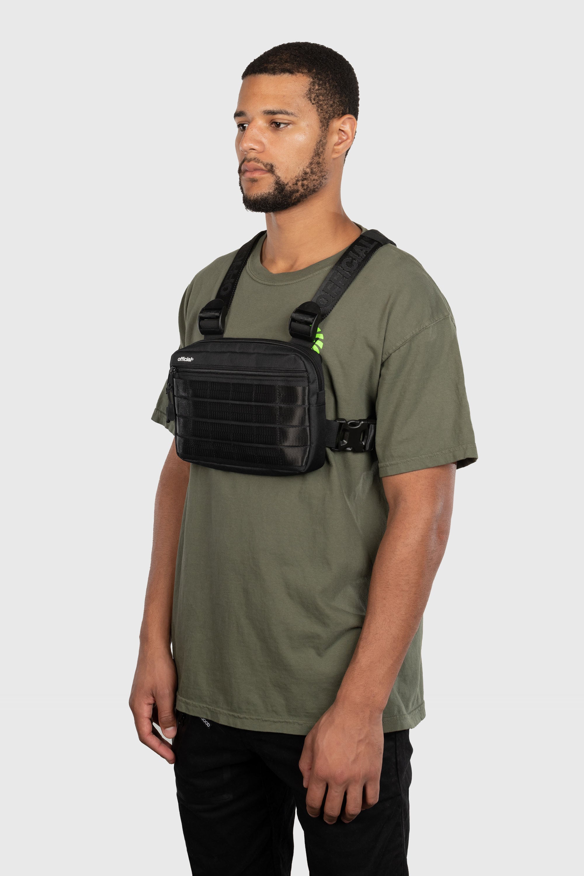  Compact Essential Chest Bag in black on person angled front view.